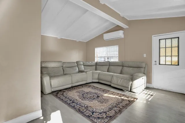 a living room with furniture and a couch