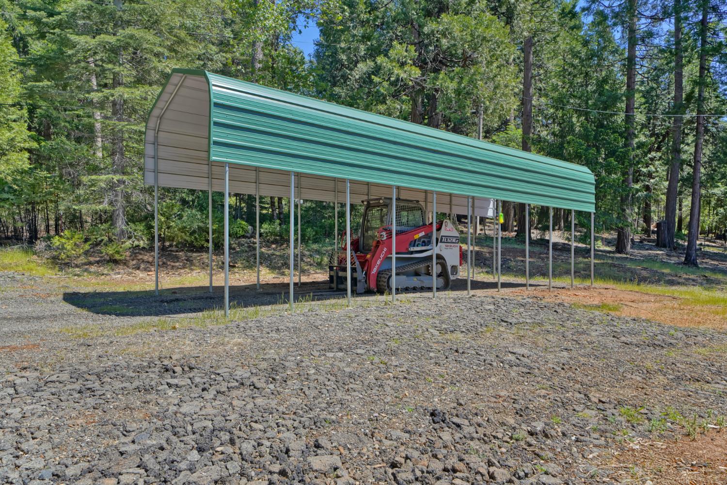 2320 Old Blair Mill Road Pollock Pines, CA 95726 - Photo 42 of 45 RV carport. Large flat area with cargo container and RV carport. This area has (separate from house) well, water tank, power and septic!