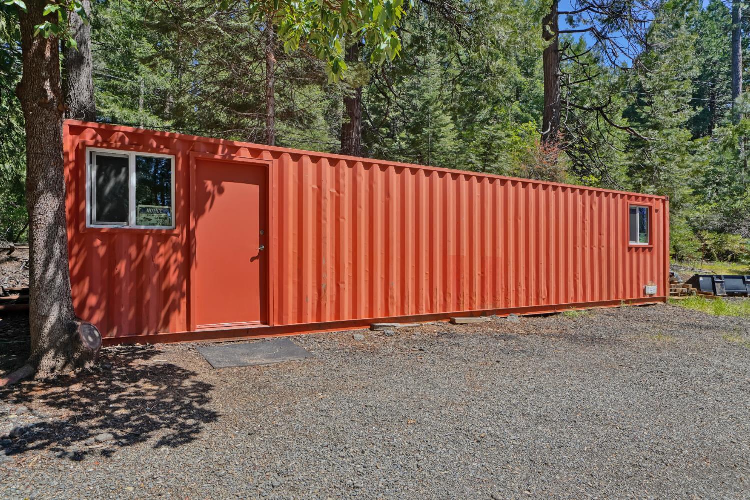 2320 Old Blair Mill Road Pollock Pines, CA 95726 - Photo 43 of 45 Large flat area with cargo container. This area has (separate from house) well, water tank, power and septic!