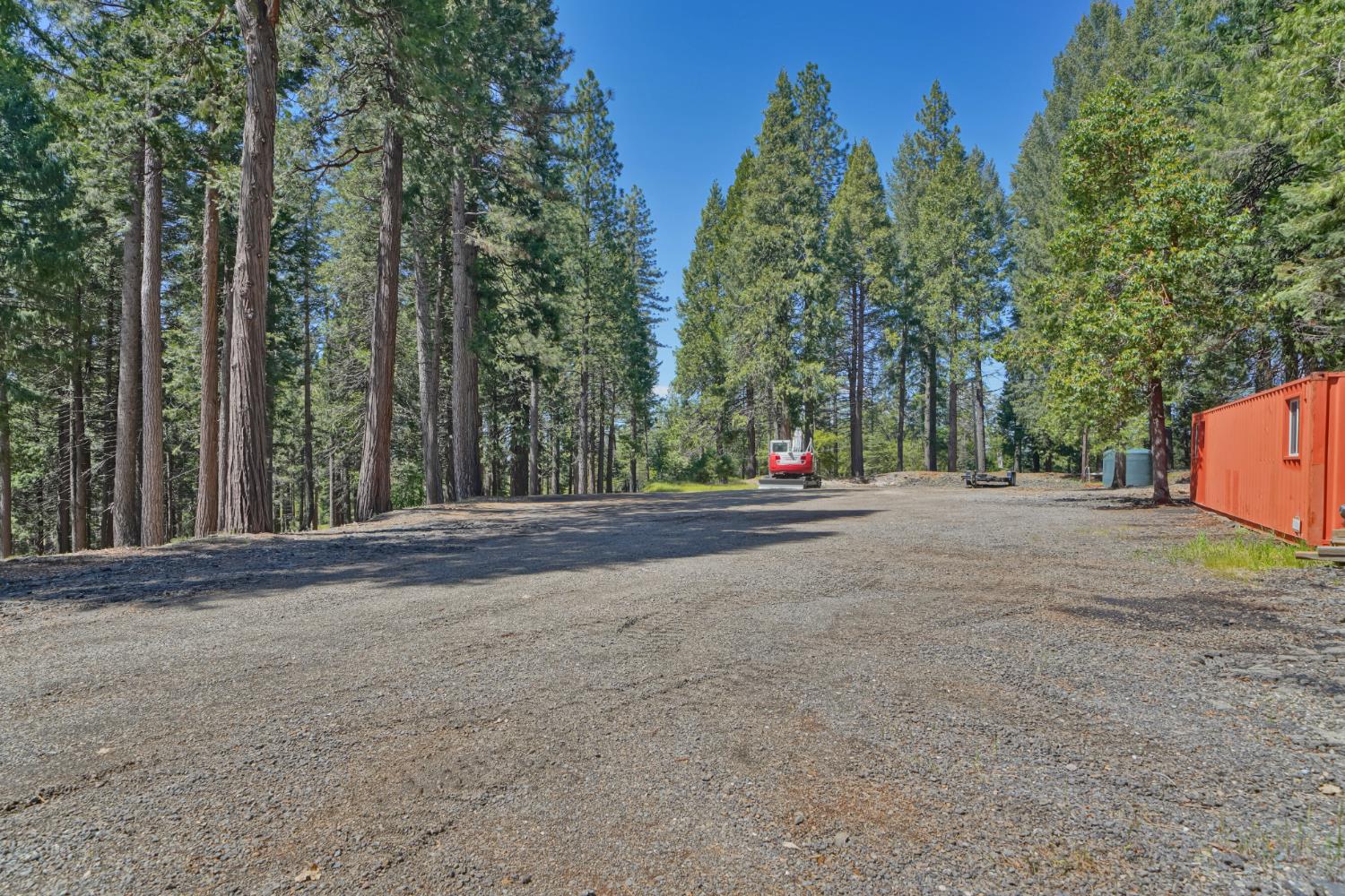 2320 Old Blair Mill Road Pollock Pines, CA 95726 - Photo 44 of 45 Large flat area with cargo container. This area has (separate from house) well, water tank, power and septic!
