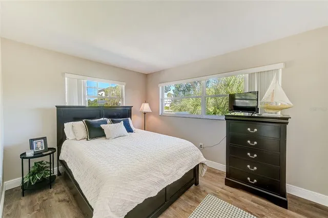 a view of a house with a swimming pool and a yard