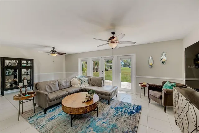 a kitchen with granite countertop a refrigerator stove top oven and sink