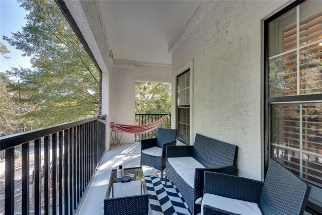 a view of balcony with furniture