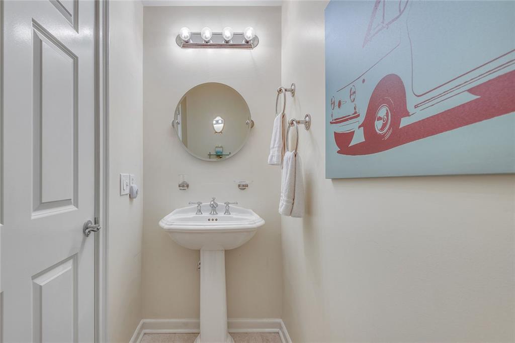 3275 Lenox Road Northeast, Unit 108 Atlanta, GA 30324 - Photo 15 of 22 a bathroom with a sink and a mirror