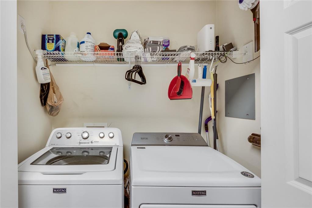 3275 Lenox Road Northeast, Unit 108 Atlanta, GA 30324 - Photo 16 of 22 a utility room with dryer and washer