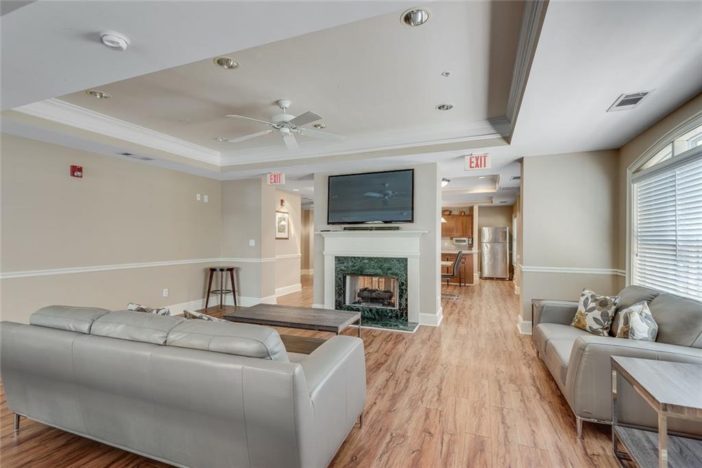3275 Lenox Road Northeast, Unit 108 Atlanta, GA 30324 - Photo 19 of 22 a living room with furniture and a fireplace