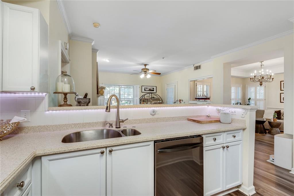 3275 Lenox Road Northeast, Unit 108 Atlanta, GA 30324 - Photo 5 of 22 a kitchen with a sink and cabinets