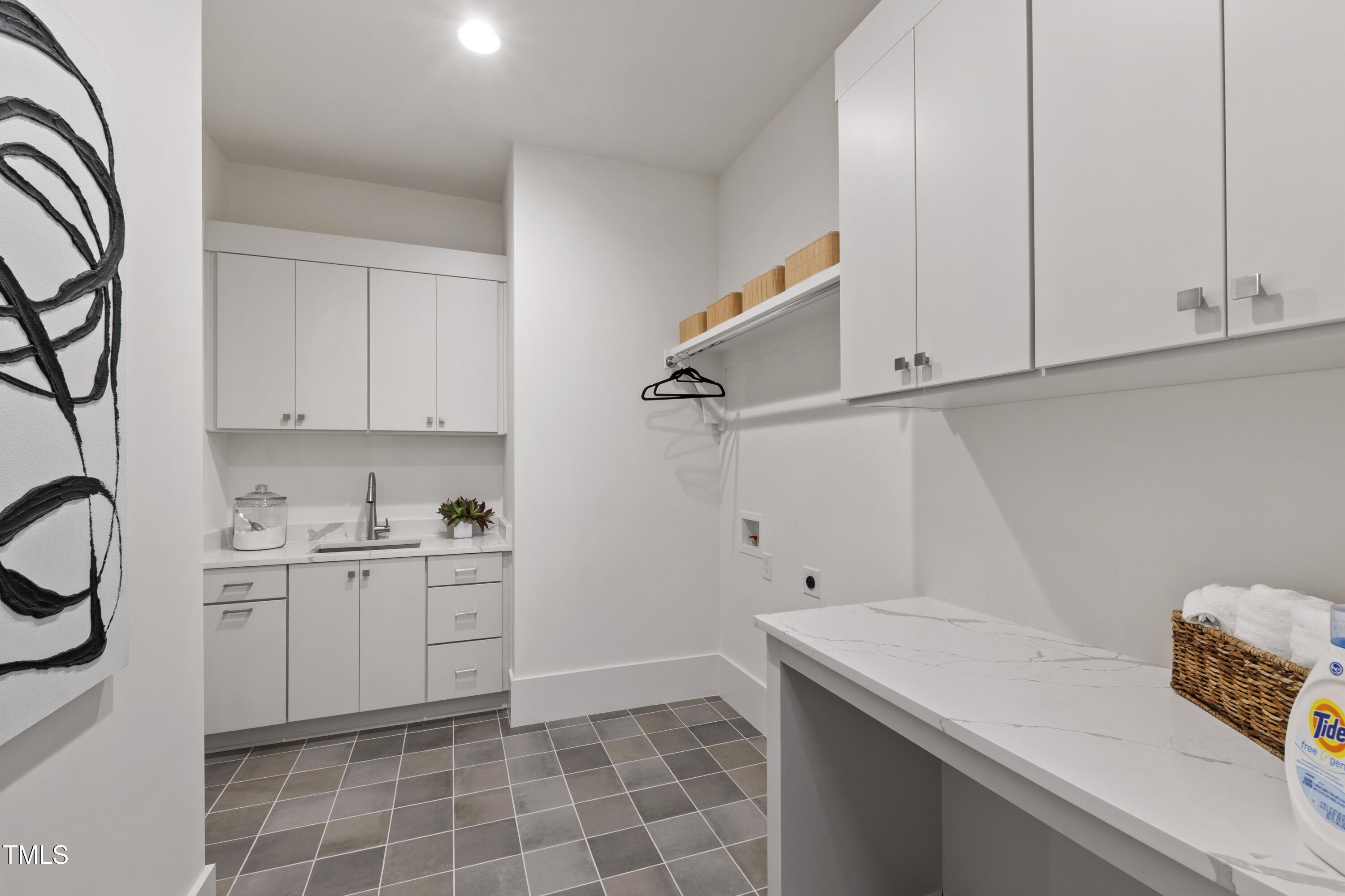 5208 Knollwood Road Raleigh, NC 27609 - Photo 28 of 62 a kitchen with a sink cabinets and appliances