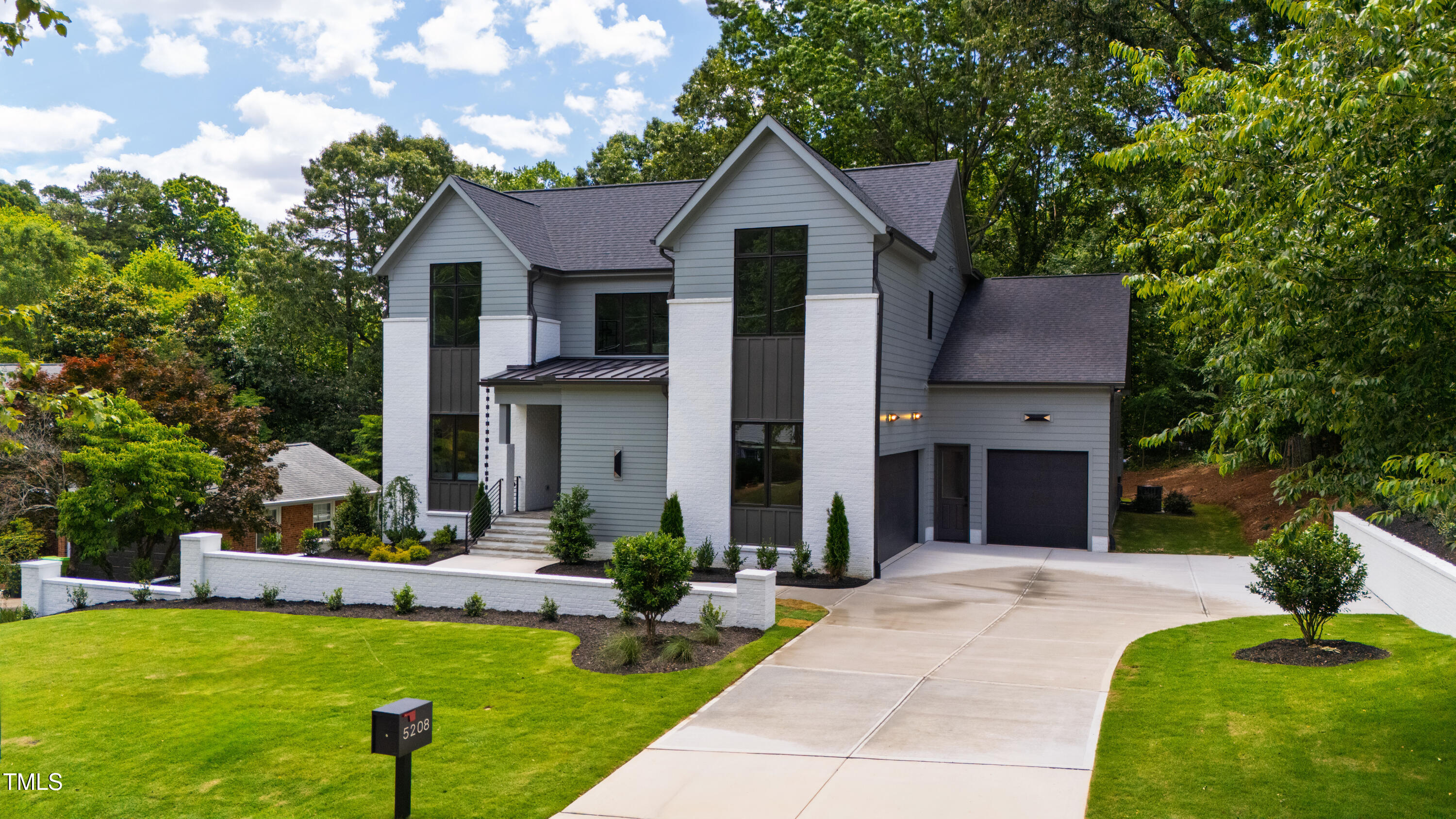 5208 Knollwood Road Raleigh, NC 27609 - Photo 3 of 62 a front view of house with yard and green space