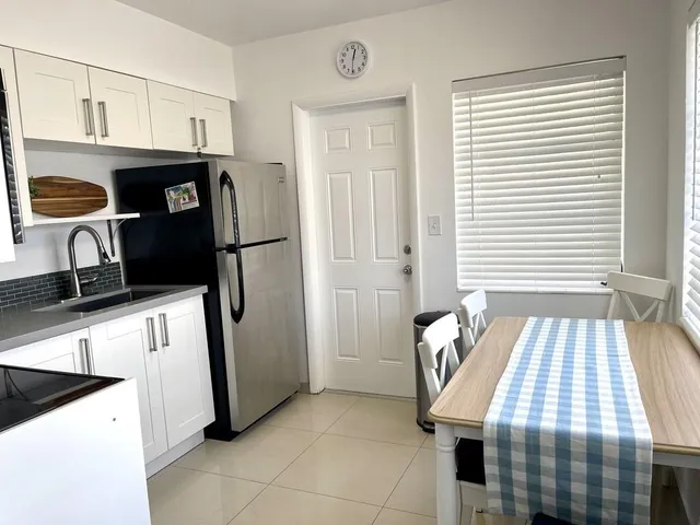 a bedroom with a bed and a tv