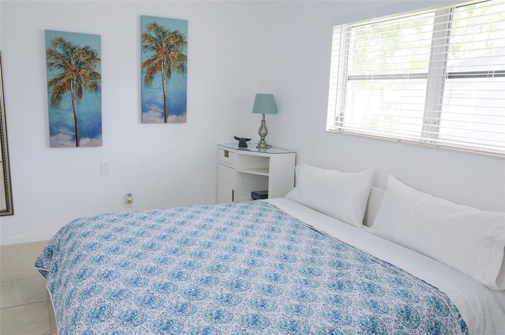 29 Northeast 3rd Street Dania Beach, FL 33004 - Photo 25 of 31 a bedroom with a bed and a window