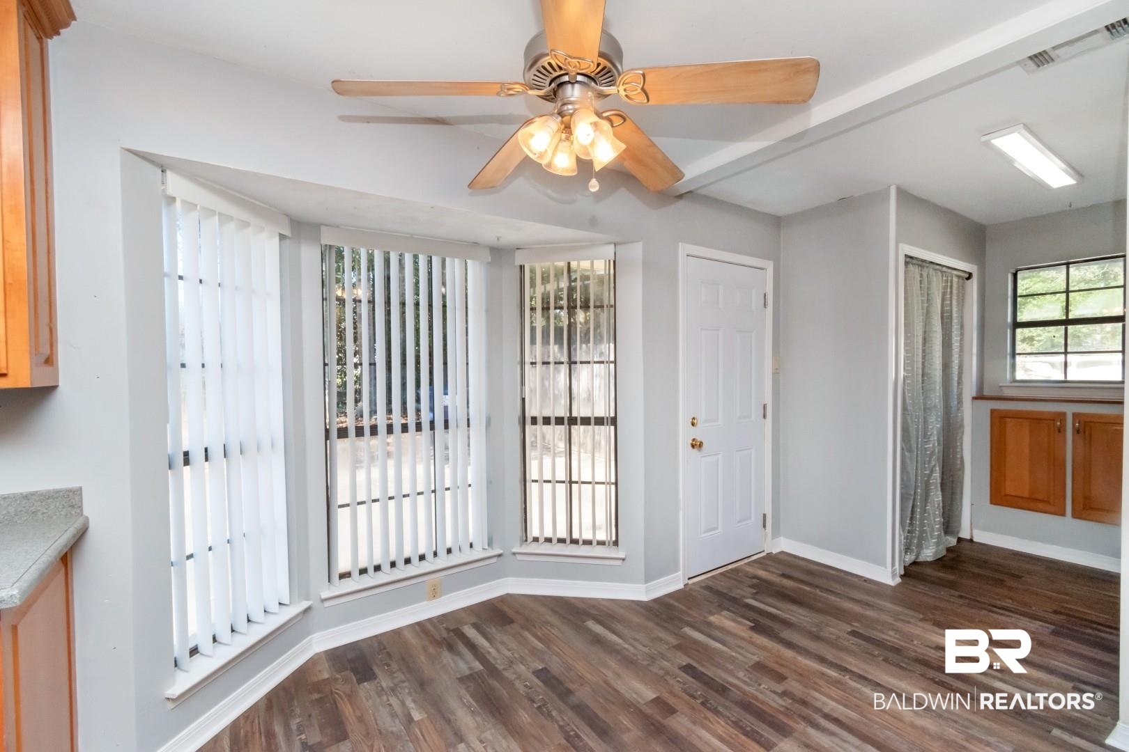8304 Champlain Circle Mobile, AL 36695 - Photo 6 of 46 Unfurnished dining area with dark hardwood / wood-style flooring and ceiling fan