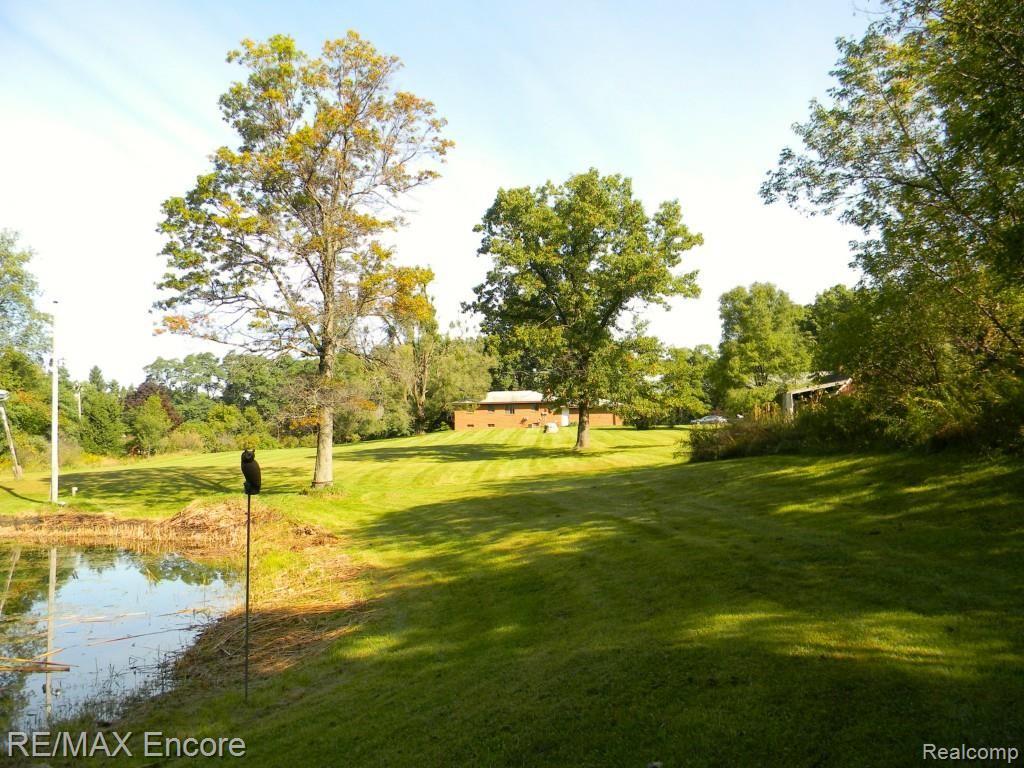 9475 Oakhill Road Holly, MI 48442 - Photo 23 of 32 From pond looking toward house