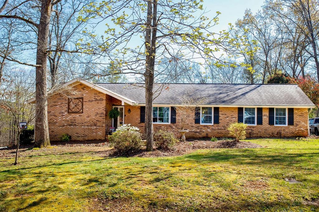 211 Margo Trail Southeast Rome, GA 30161 - Photo 1 of 1 a front view of house with yard and trees around