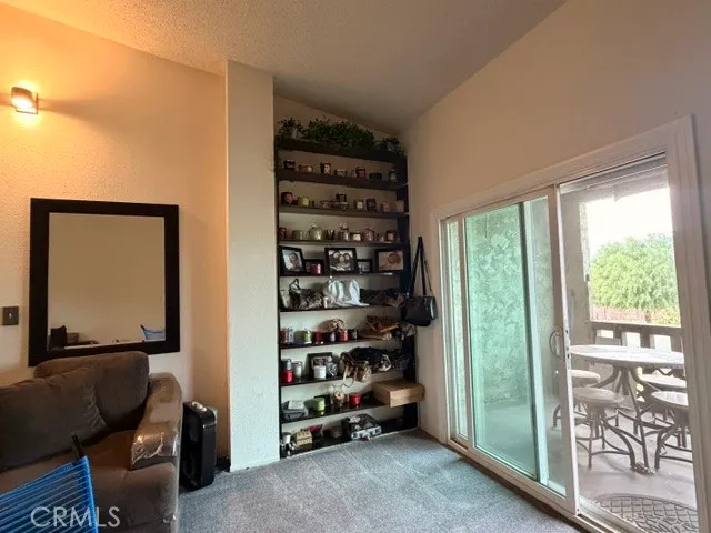a view of a livingroom with shelves