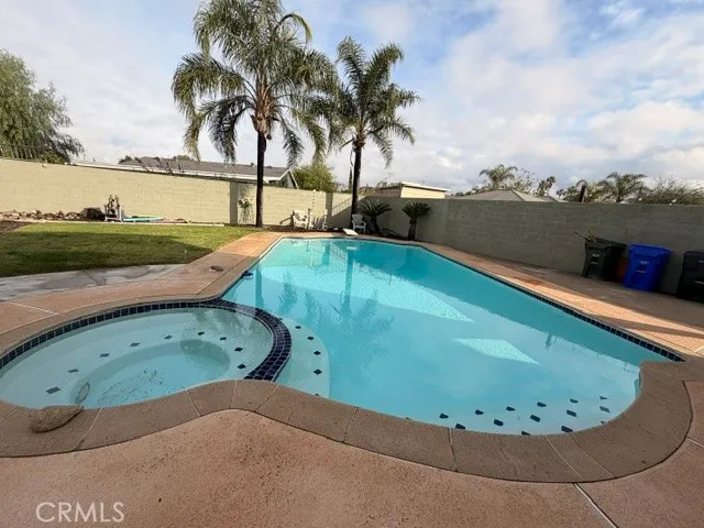a view of a swimming pool with a lounge chair