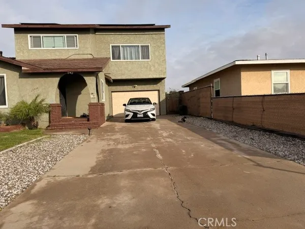 a view of a car park in front of house