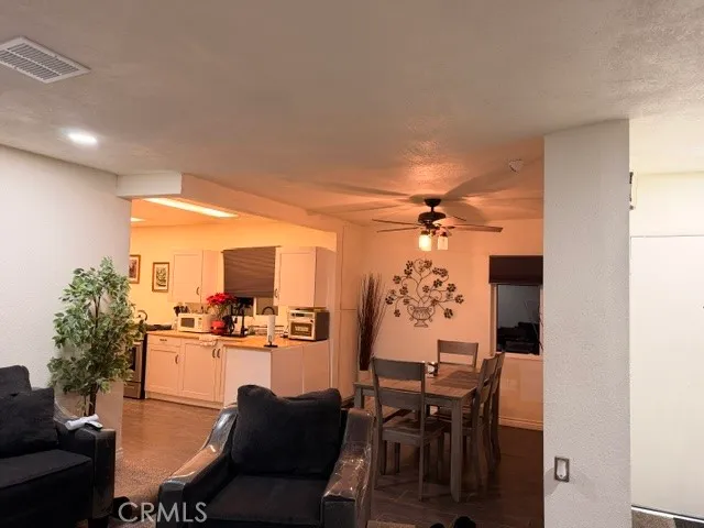 a dining room with furniture and a chandelier