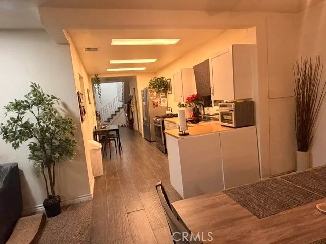 a view of a living room and dining room