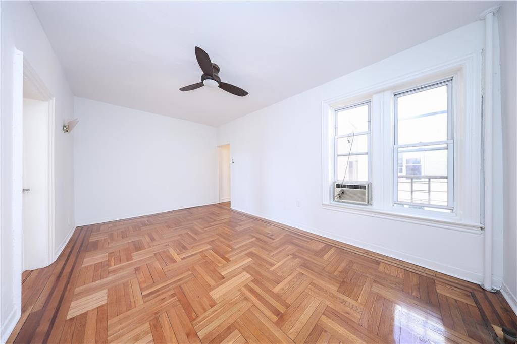 1489 East 8th Street, Unit C2 Brooklyn, NY 11230 - Photo 14 of 15 a view of a bedroom with a bed and a window