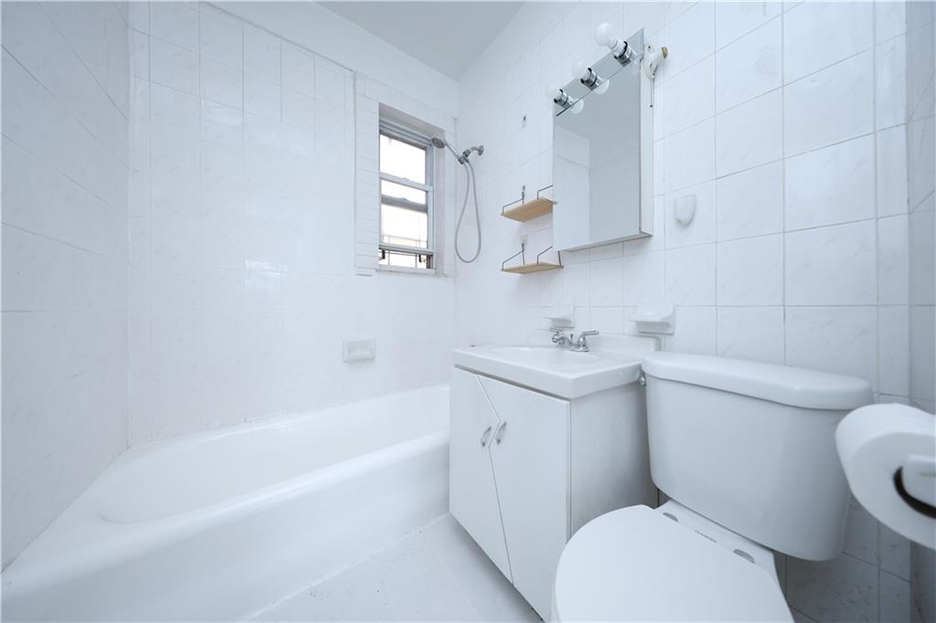 1489 East 8th Street, Unit C2 Brooklyn, NY 11230 - Photo 15 of 15 a bathroom with a sink a toilet and bathtub
