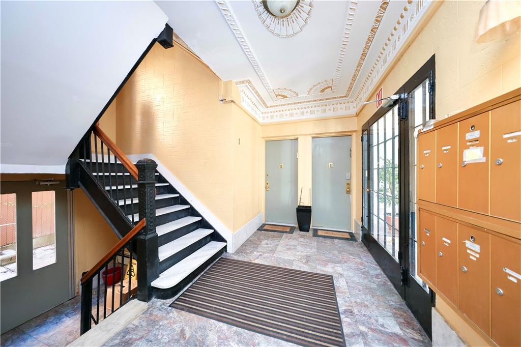 1489 East 8th Street, Unit C2 Brooklyn, NY 11230 - Photo 3 of 15 a view of an entryway with wooden floor and stairs