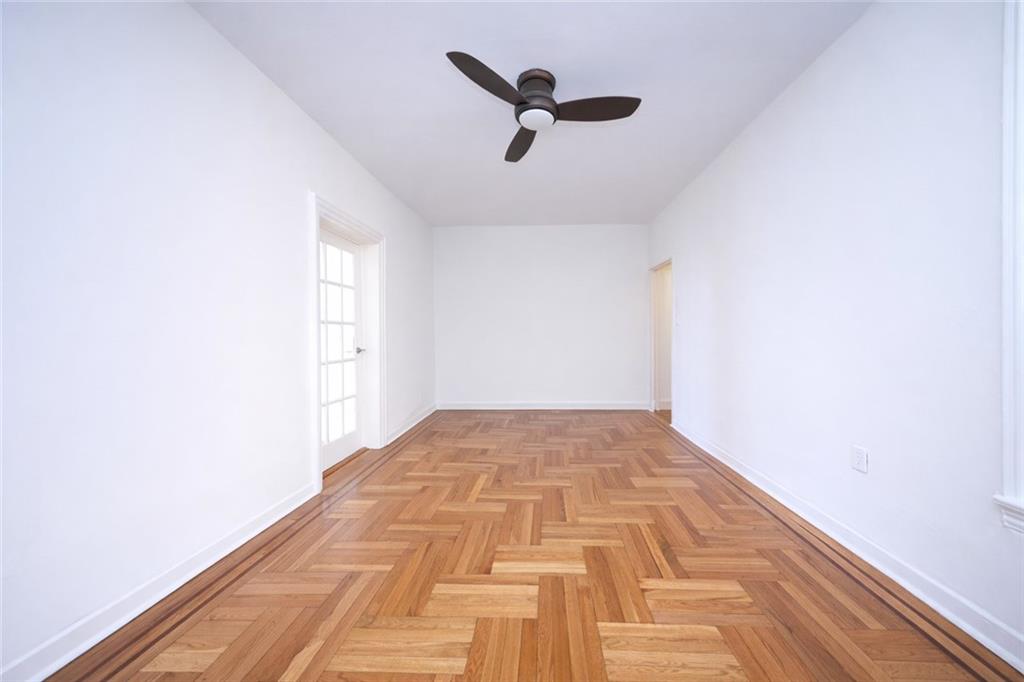 1489 East 8th Street, Unit C2 Brooklyn, NY 11230 - Photo 6 of 15 a view of empty room with wooden floor