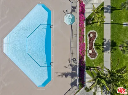 a view of a swimming pool with outdoor seating