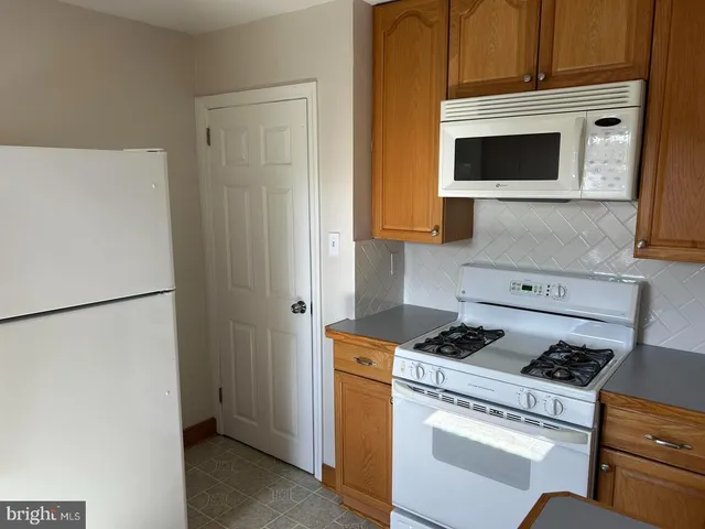 a kitchen with a stove and a microwave