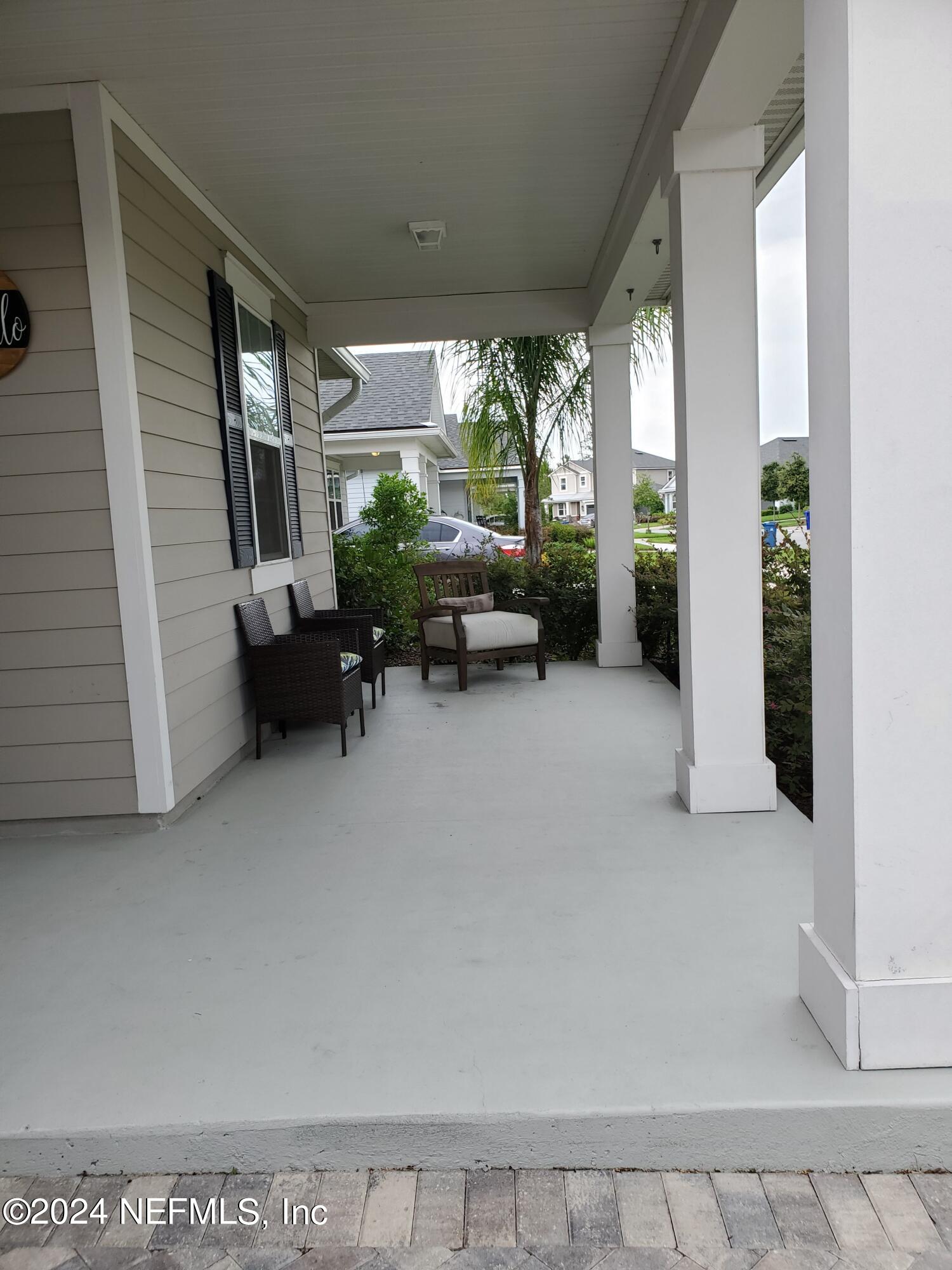 166 Palisade Drive St. Augustine, FL 32092 - Photo 4 of 8 a living room with furniture and a large window
