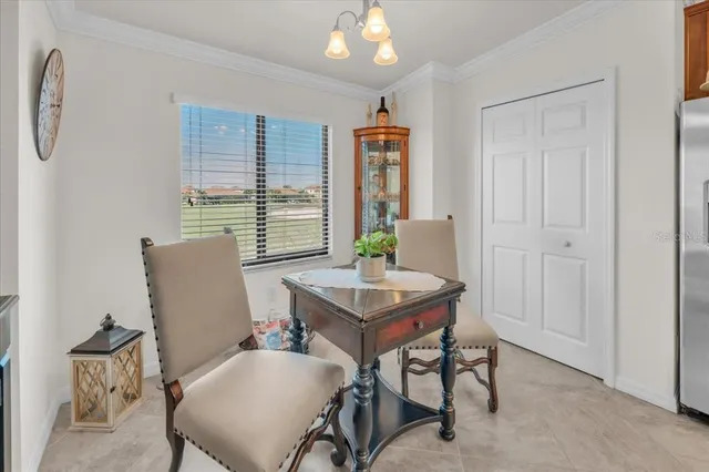 a view of a dining room with furniture window and outside view