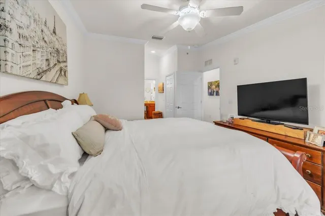 a bedroom with bed and tv