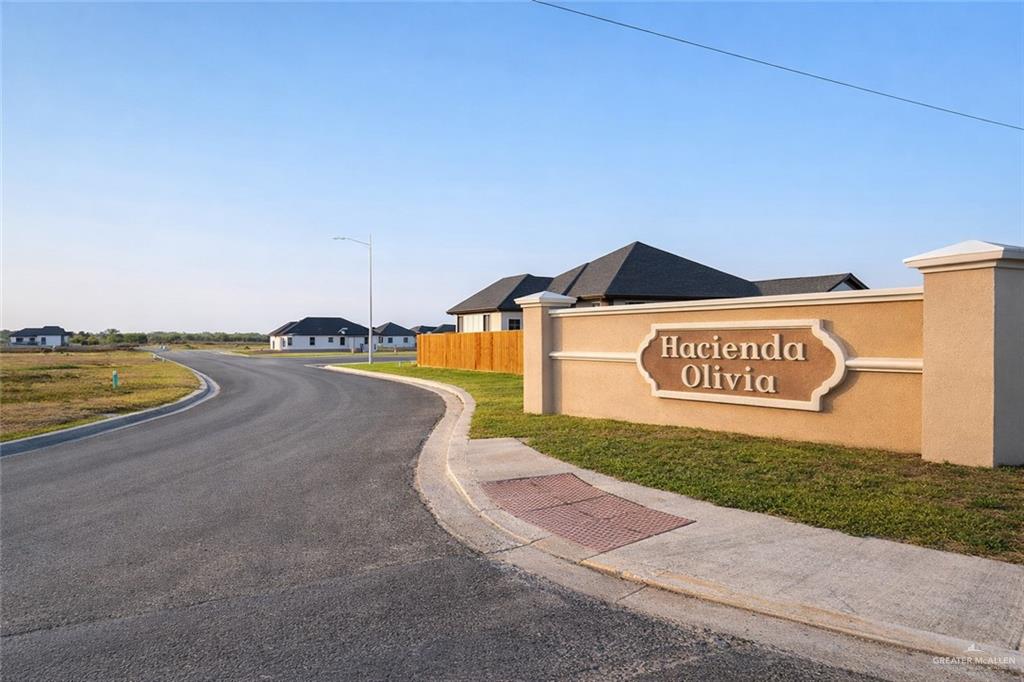 a view of a street with an ocean view