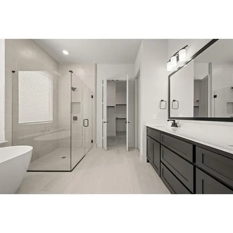 a bathroom with a bathtub and shower