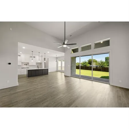 a kitchen with kitchen island a sink stainless steel appliances and cabinets