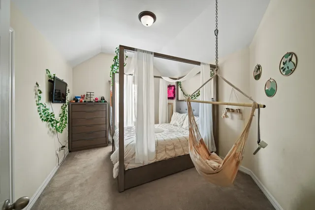 a view of a hallway with painted walls and stairs