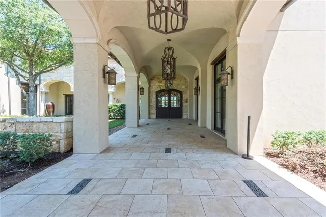 a view of a swimming pool with a patio and mountain view