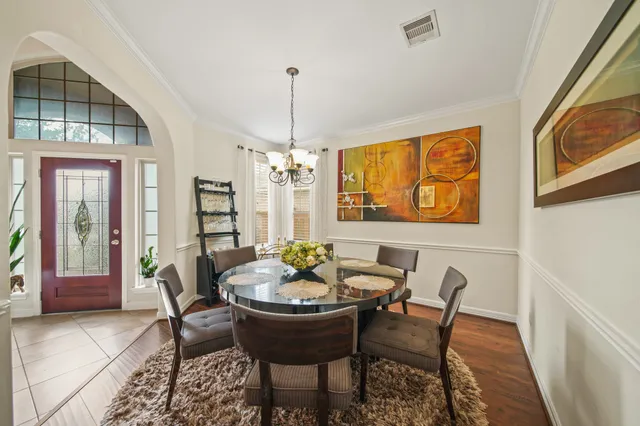 a dining room with furniture and window