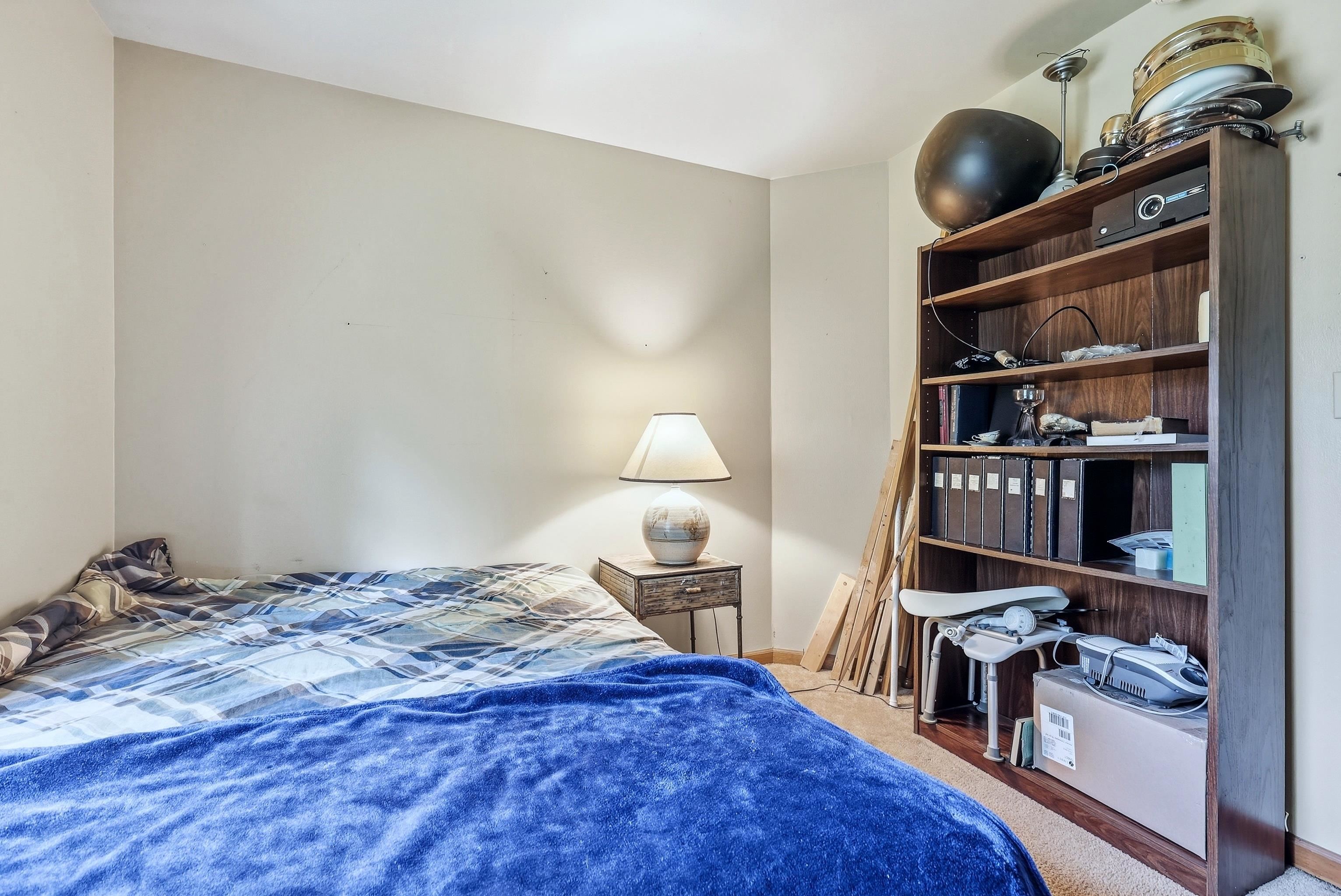 13 Signal Point Lane Galena, IL 61036 - Photo 11 of 47 a bedroom with a bed and a bookshelf
