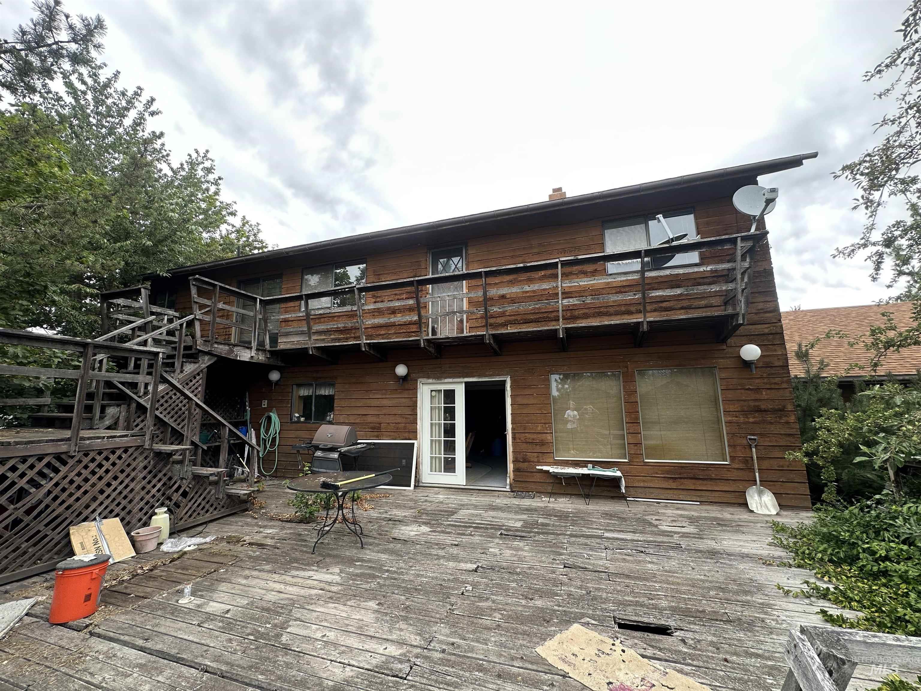 811 Florence Avenue Craigmont, ID 83523 - Photo 42 of 48 Back of house featuring a balcony, a deck, and stairway