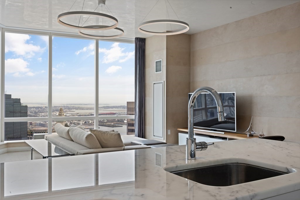 1 Franklin Street, Unit 5204 Boston, MA 02110 - Photo 12 of 40 a kitchen with a sink and a view of living room