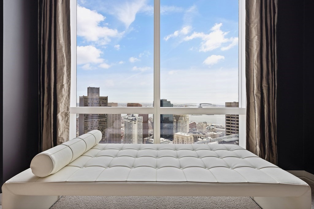 1 Franklin Street, Unit 5204 Boston, MA 02110 - Photo 19 of 40 a view of a balcony with white furniture