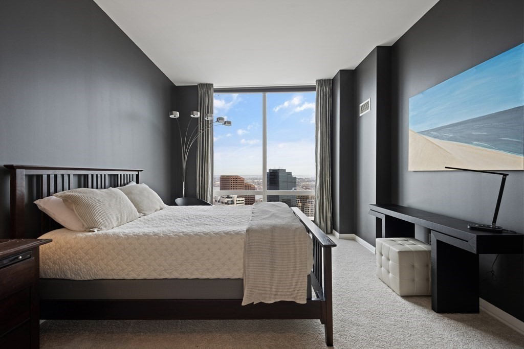 1 Franklin Street, Unit 5204 Boston, MA 02110 - Photo 24 of 40 a bedroom with a bed and a large window