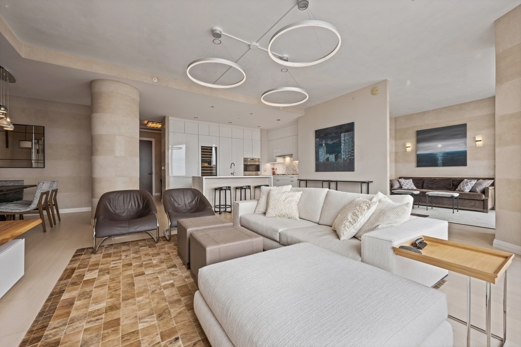 1 Franklin Street, Unit 5204 Boston, MA 02110 - Photo 7 of 40 a living room with furniture and a flat screen tv