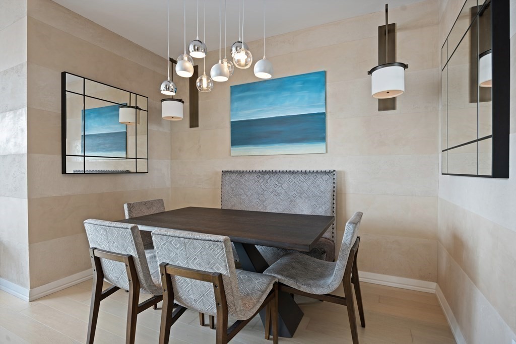 1 Franklin Street, Unit 5204 Boston, MA 02110 - Photo 9 of 40 a dining room with furniture and window