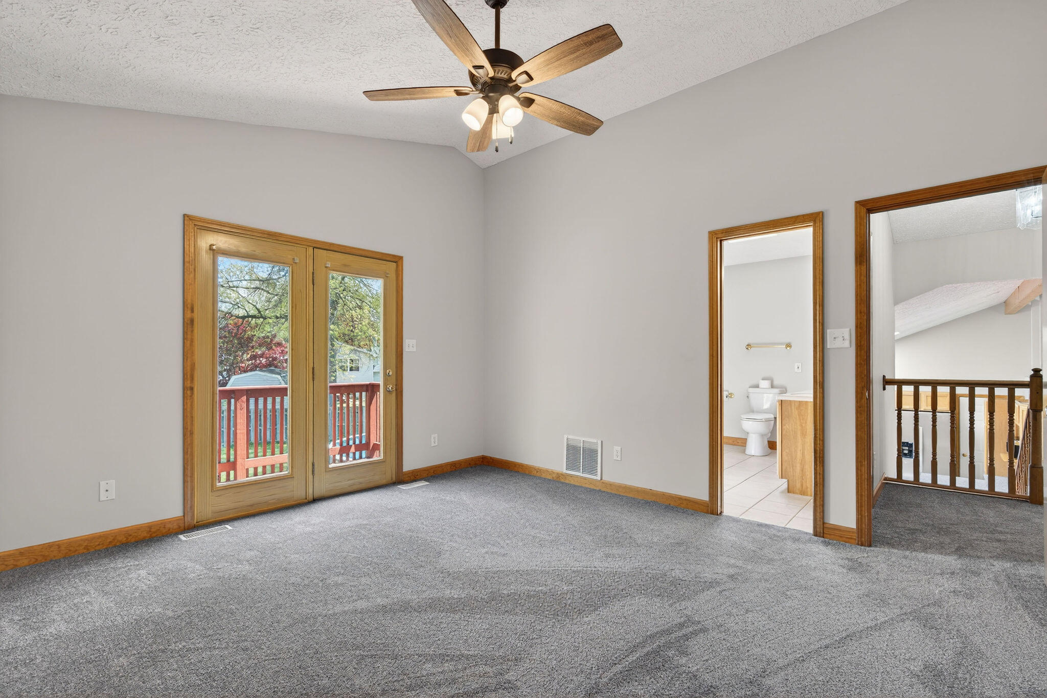 2447 Joseph Avenue Portage, IN 46368 - Photo 13 of 33 an empty room with chandelier fan and windows