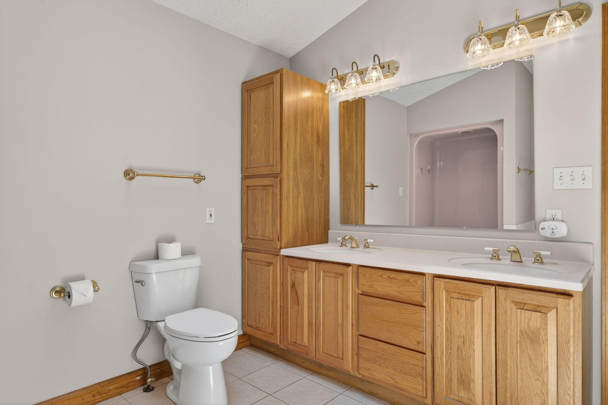 2447 Joseph Avenue Portage, IN 46368 - Photo 15 of 33 a bathroom with a sink a toilet and shower