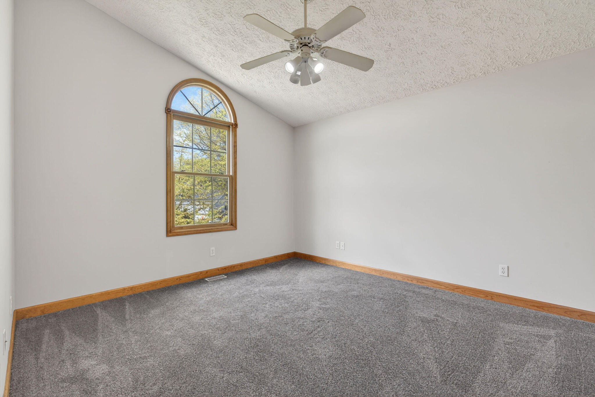 2447 Joseph Avenue Portage, IN 46368 - Photo 17 of 33 an empty room with windows and ceiling fan
