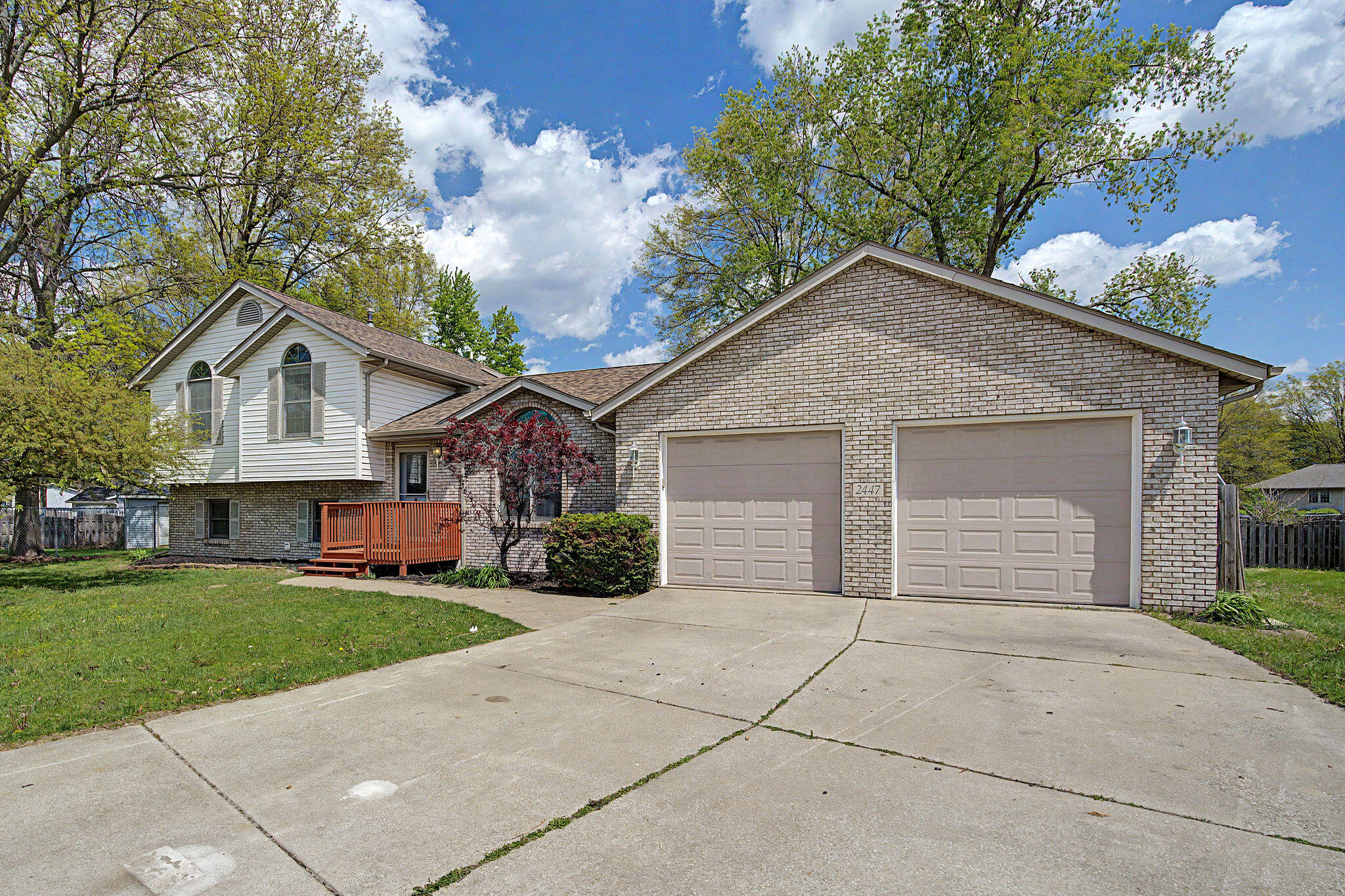 2447 Joseph Avenue Portage, IN 46368 - Photo 2 of 33 a front view of a house with a garden and yard