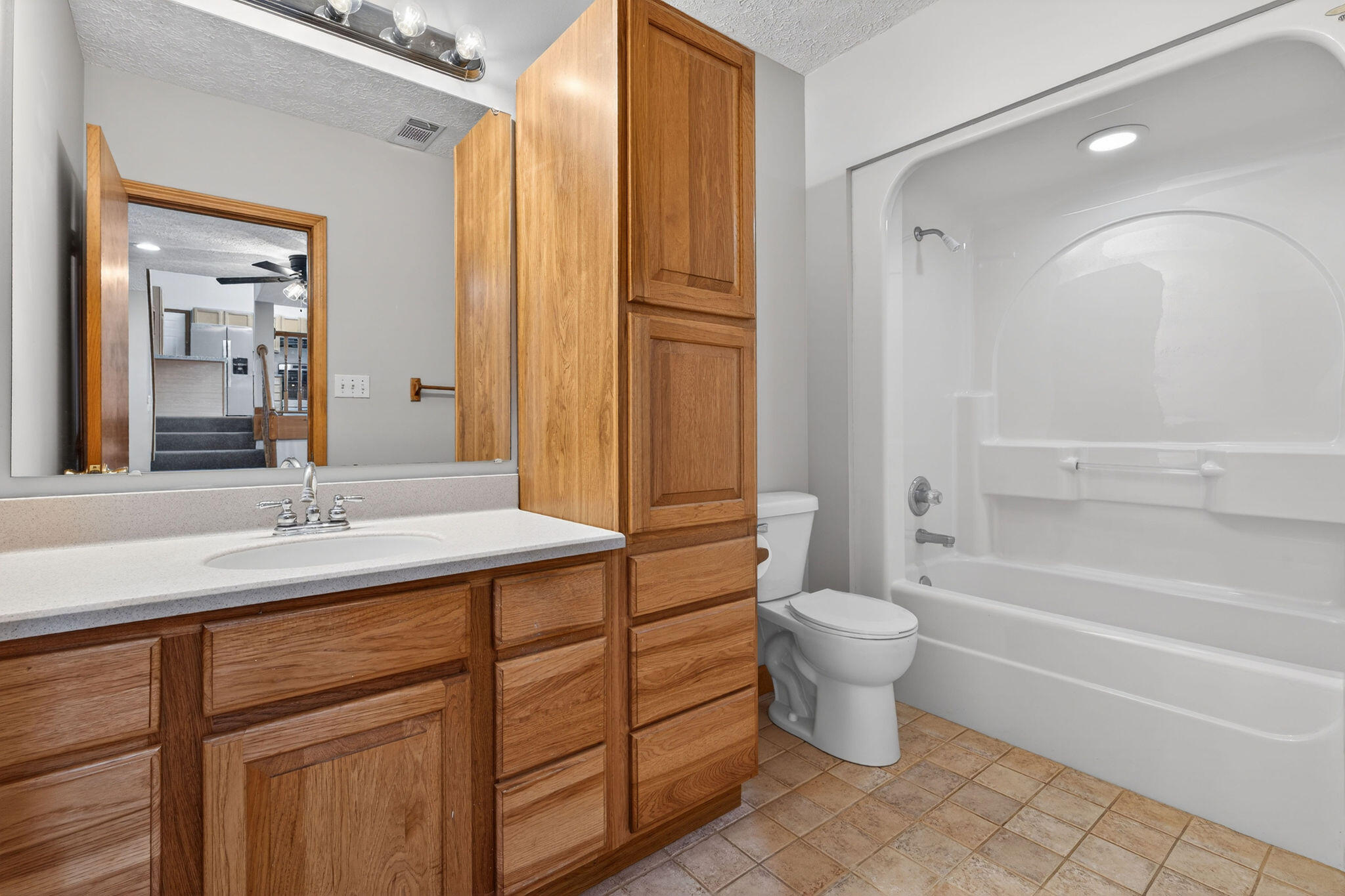 2447 Joseph Avenue Portage, IN 46368 - Photo 23 of 33 a bathroom with a sink a toilet and shower